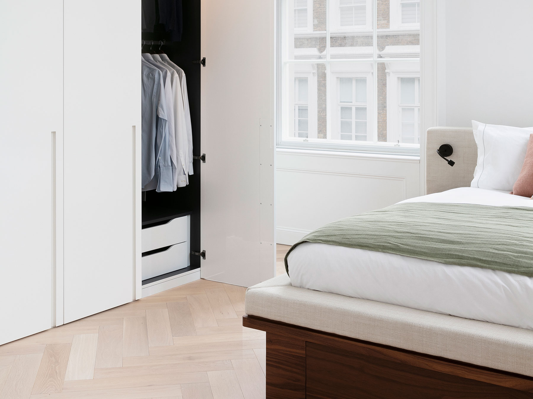 The extensive storage integrates seamlessly with complimentary panelling and doorways both out of the rooms and into en suite spaces