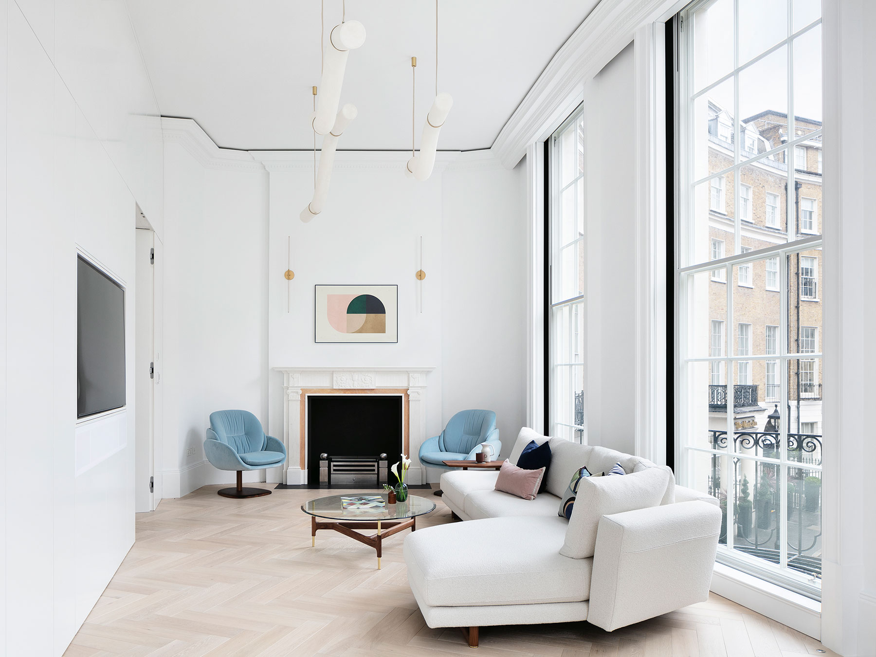 Overfview of living area created in the refurbishment of a three bedroom apartment in the City of Westminster, showing and the inset area to integrate a television flush into the wall
