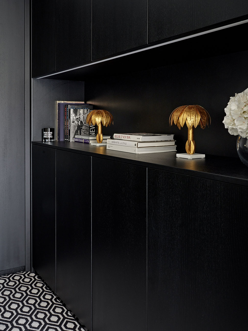 The Black Ash home office features concealed niche detailing and integrated lighting
