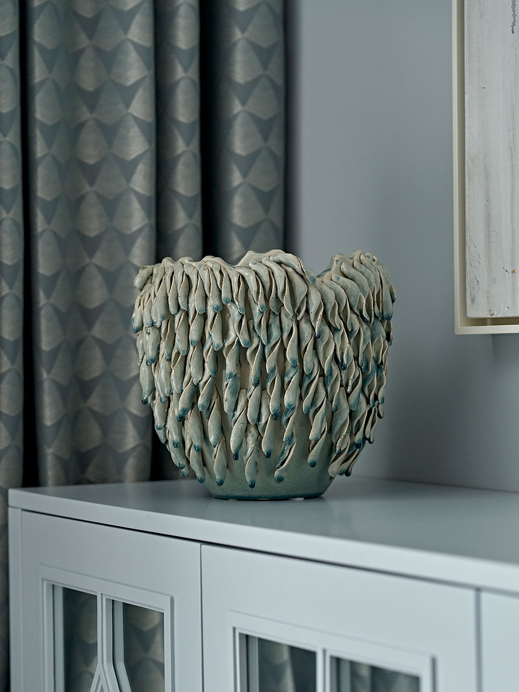 Detail photograph highlighting the beading and feature mirrors